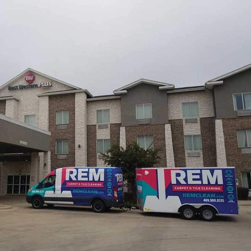 REM Trucks in front of Best West Hotel